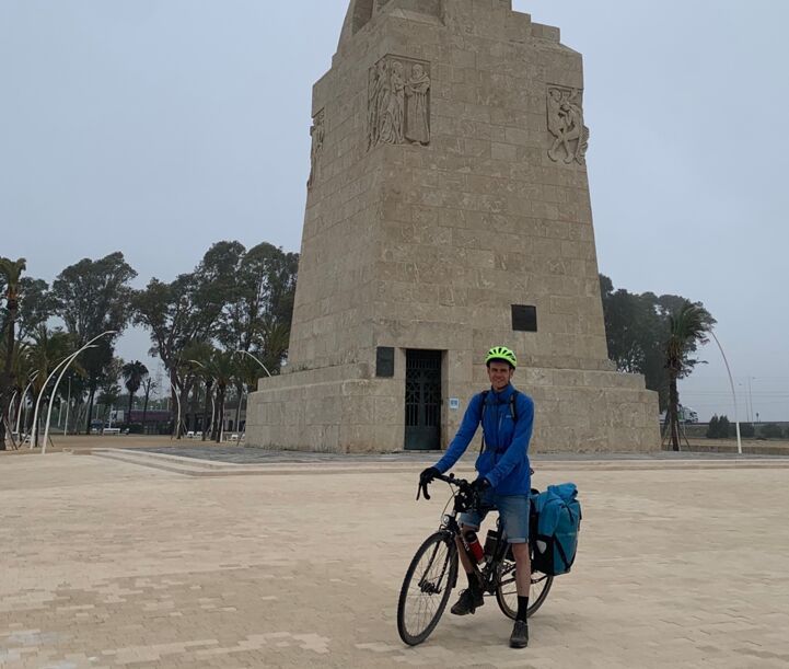 Julian in front of the monument to Columbus in Huelva (Andalusia).