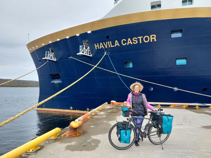 At the finish in Kirkenes in front of the Hurtigruten ferry in Norway