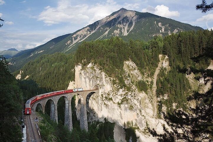Rhaetian Railway train approaching Landwasser tunnel, in Graubünden, Switzerland