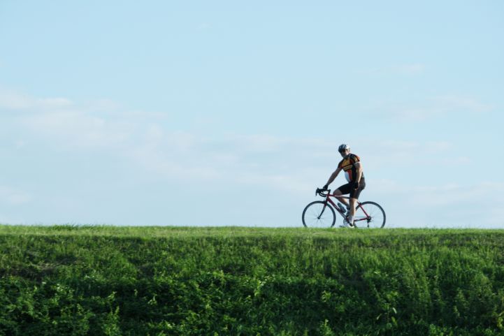 Cycling on the Po river bank in Viadana, on EuroVelo 8 - Mediterranean Route.