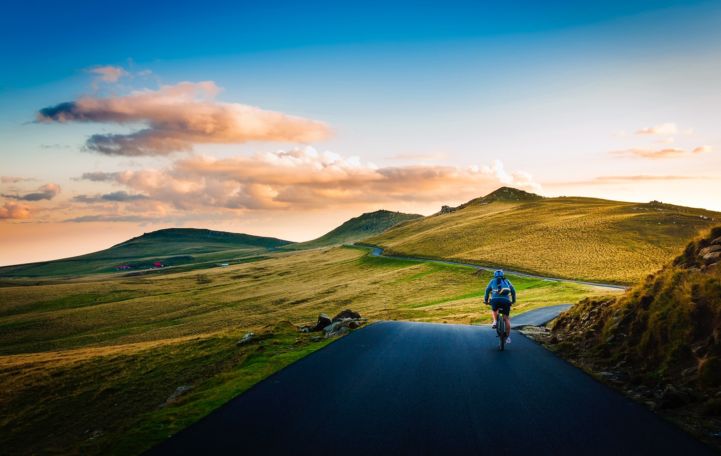 rear-view-of-man-on-mountain-road-against-sky-258045.jpg