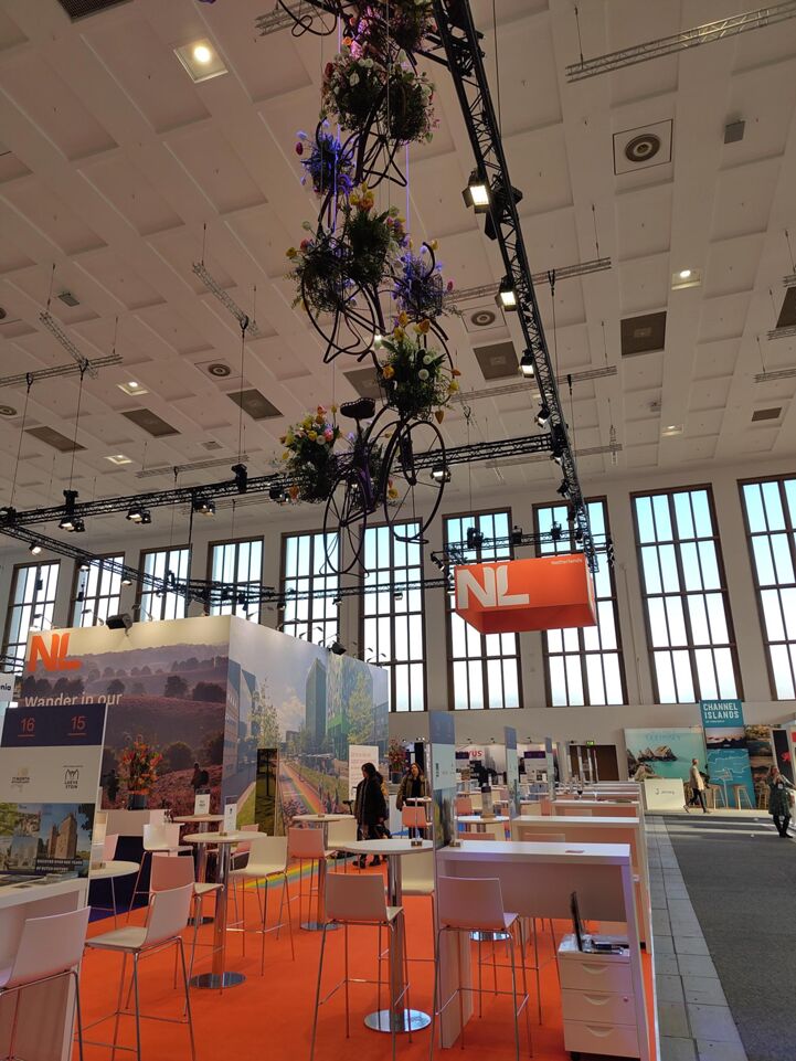 A cycling-themed Dutch booth at ITB Berlin 2025.